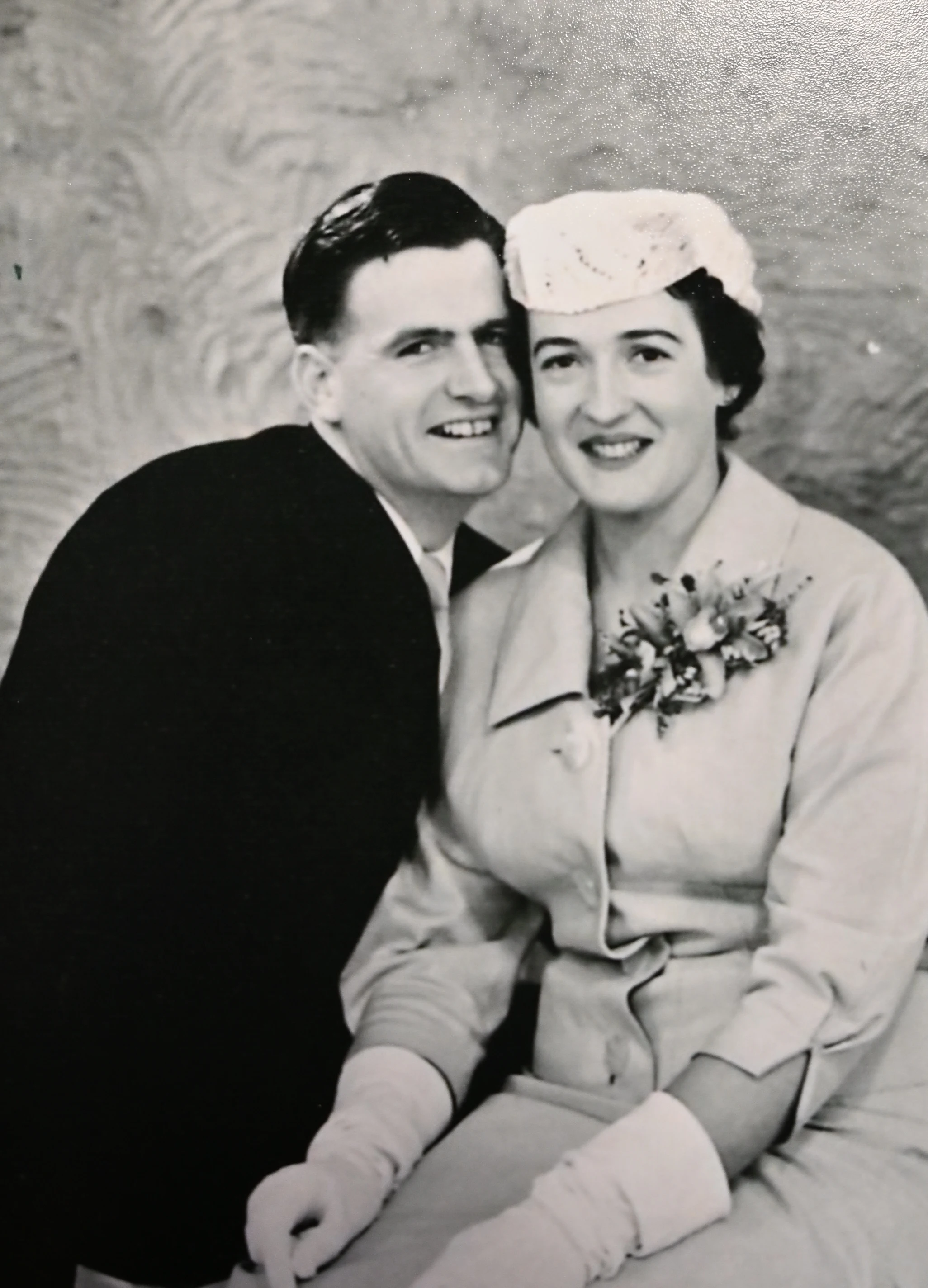 A black and white portrait of a couple on their wedding day, 1930s style