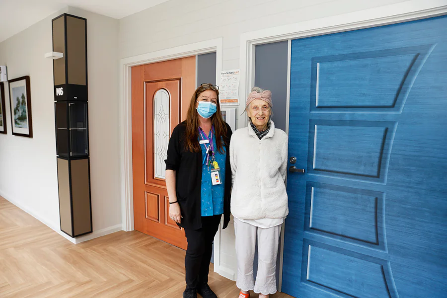 Door skins add individuality to each resident's space while also aiding those living with dementia in wayfinding.