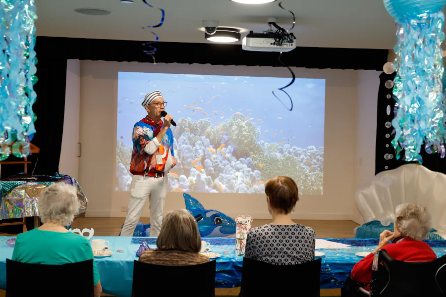 Under the Sea Quizmaster Charles dons a sailors hat and a very fishy t-shirt as he runs the games