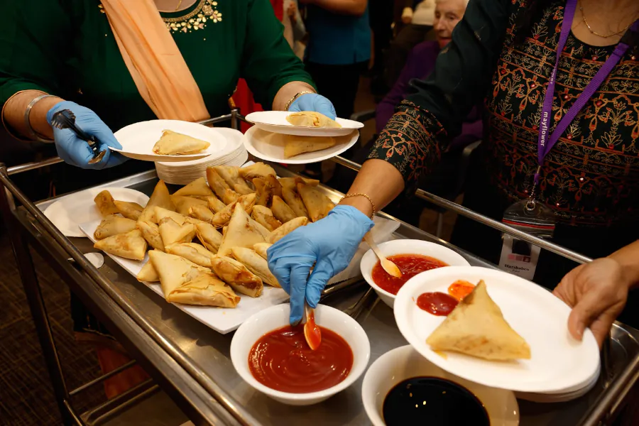 A picture samosas and sauces being served for afternoon tea