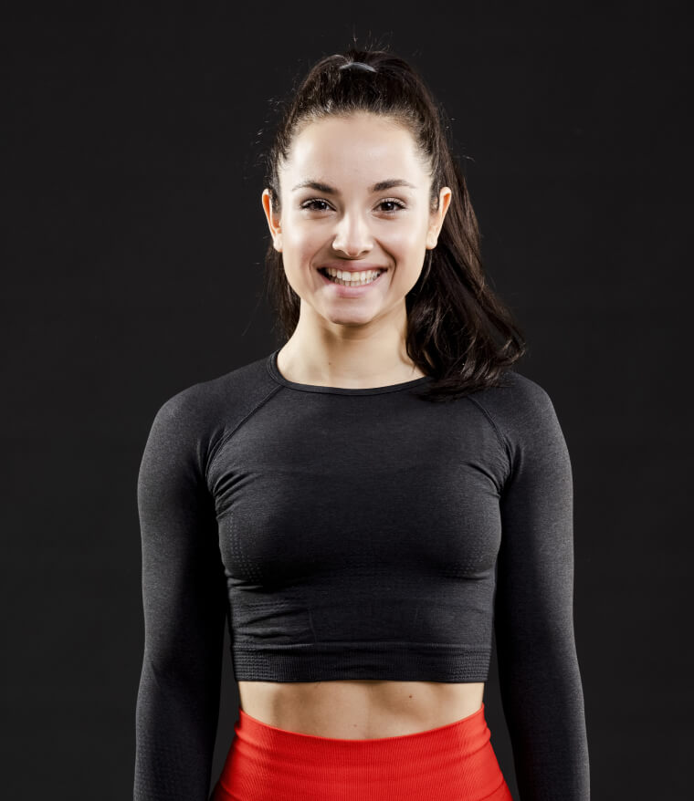 Smiling woman in a black workout top