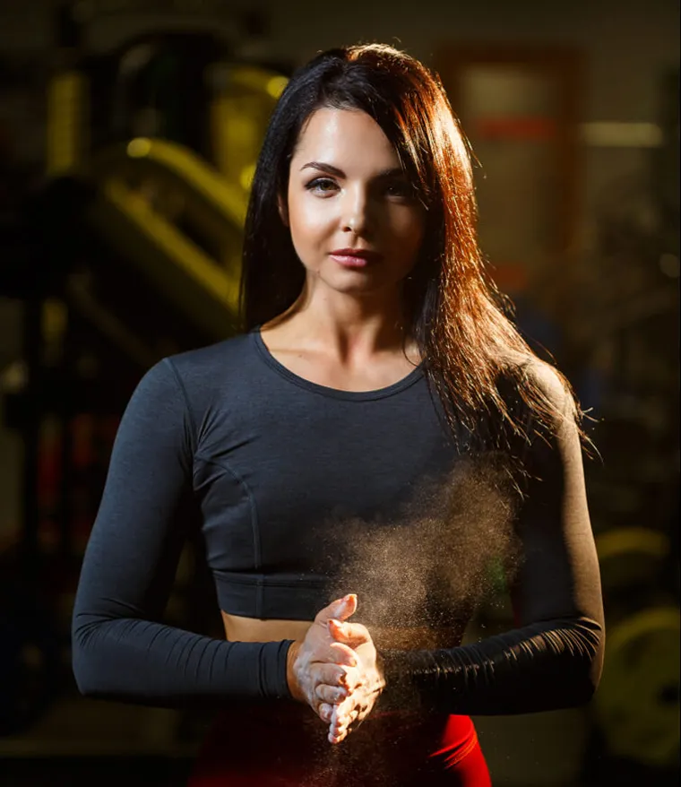 Woman clasping her hands before a workout