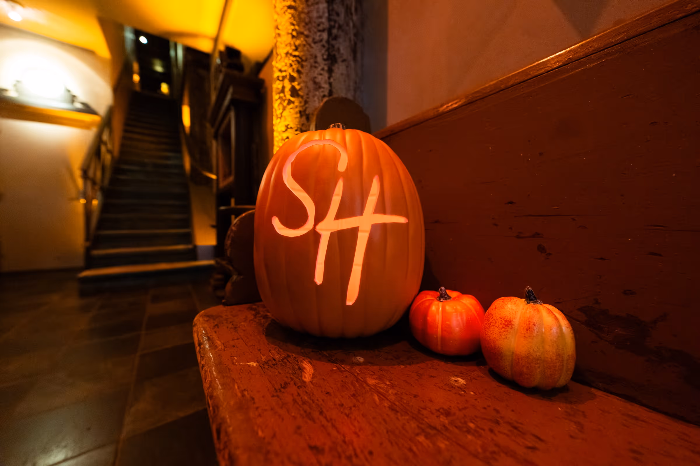 Pumpkin carved with “SH” initials at the Sally Hansen Halloween event.