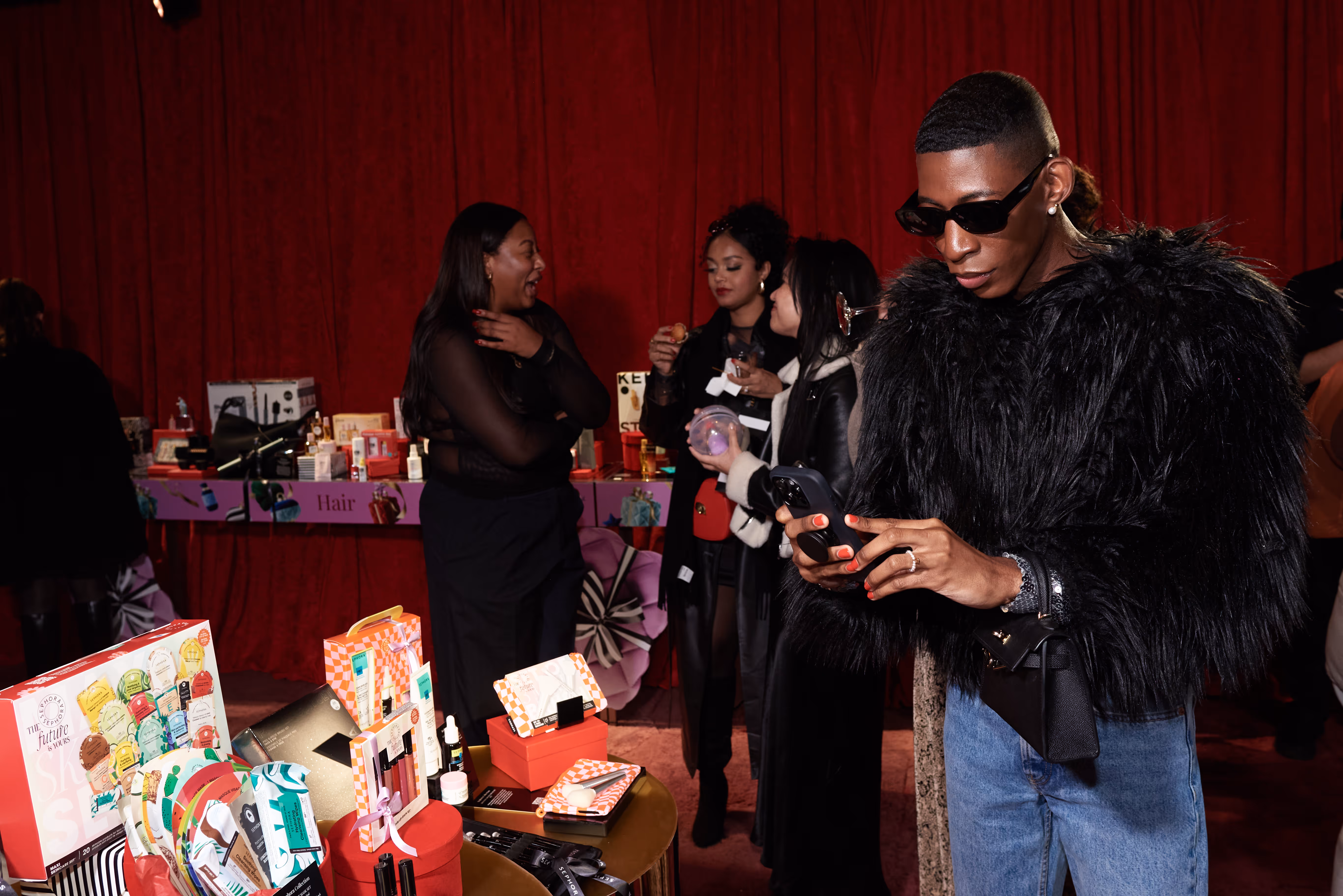 People talking: Guests talking and enjoying the Sephora Puff Love Wonderland holiday event.