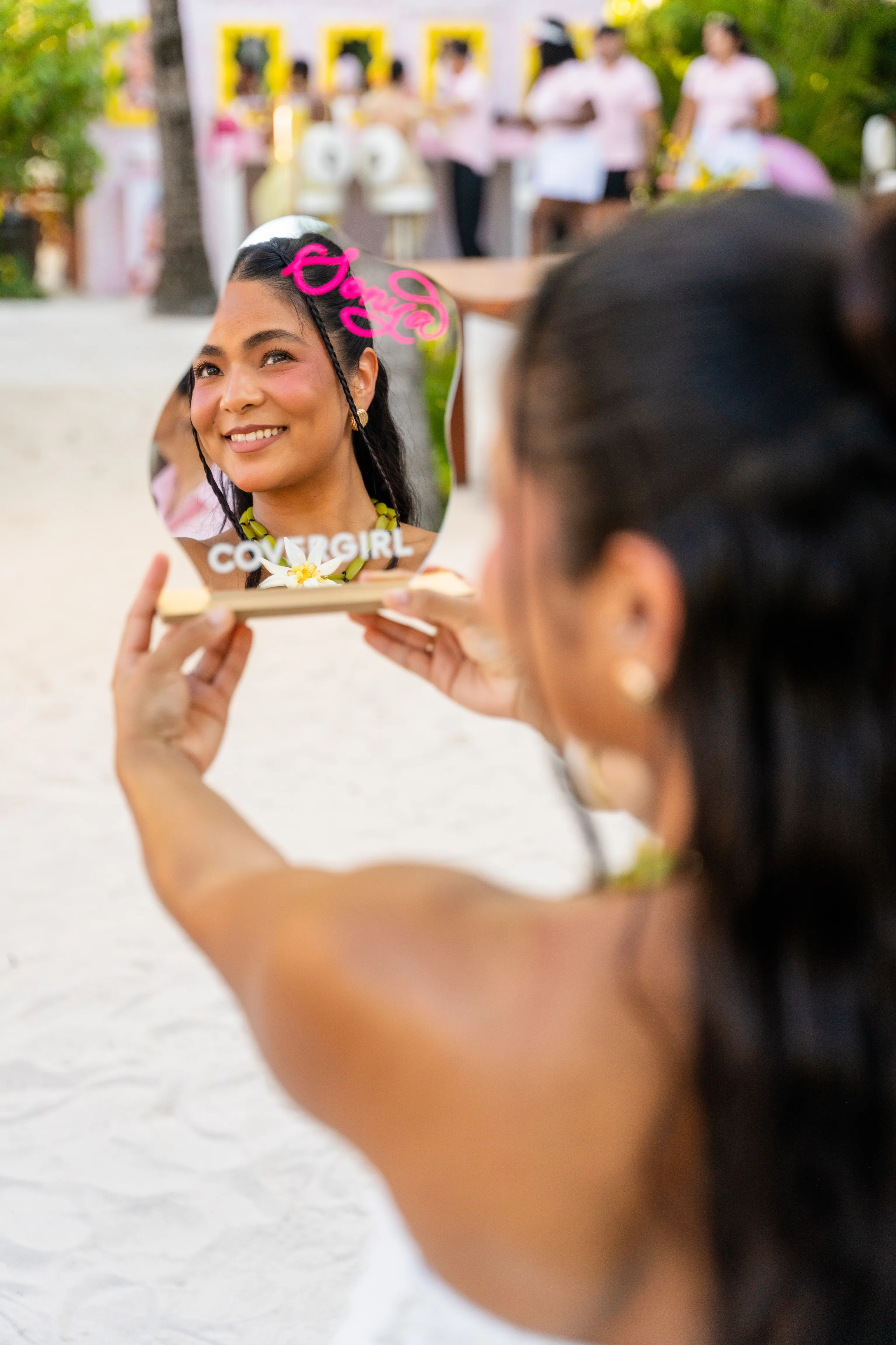 Guest taking a mirror selfie at COVERGIRL’s Blur Beach Club, capturing the soft-focus glow inspired by the Clean Fresh Blurring Skin Tint.