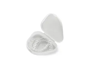 Clear retainers placed on a plain background.