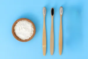Baking soda and toothbrushes on a blurred background 