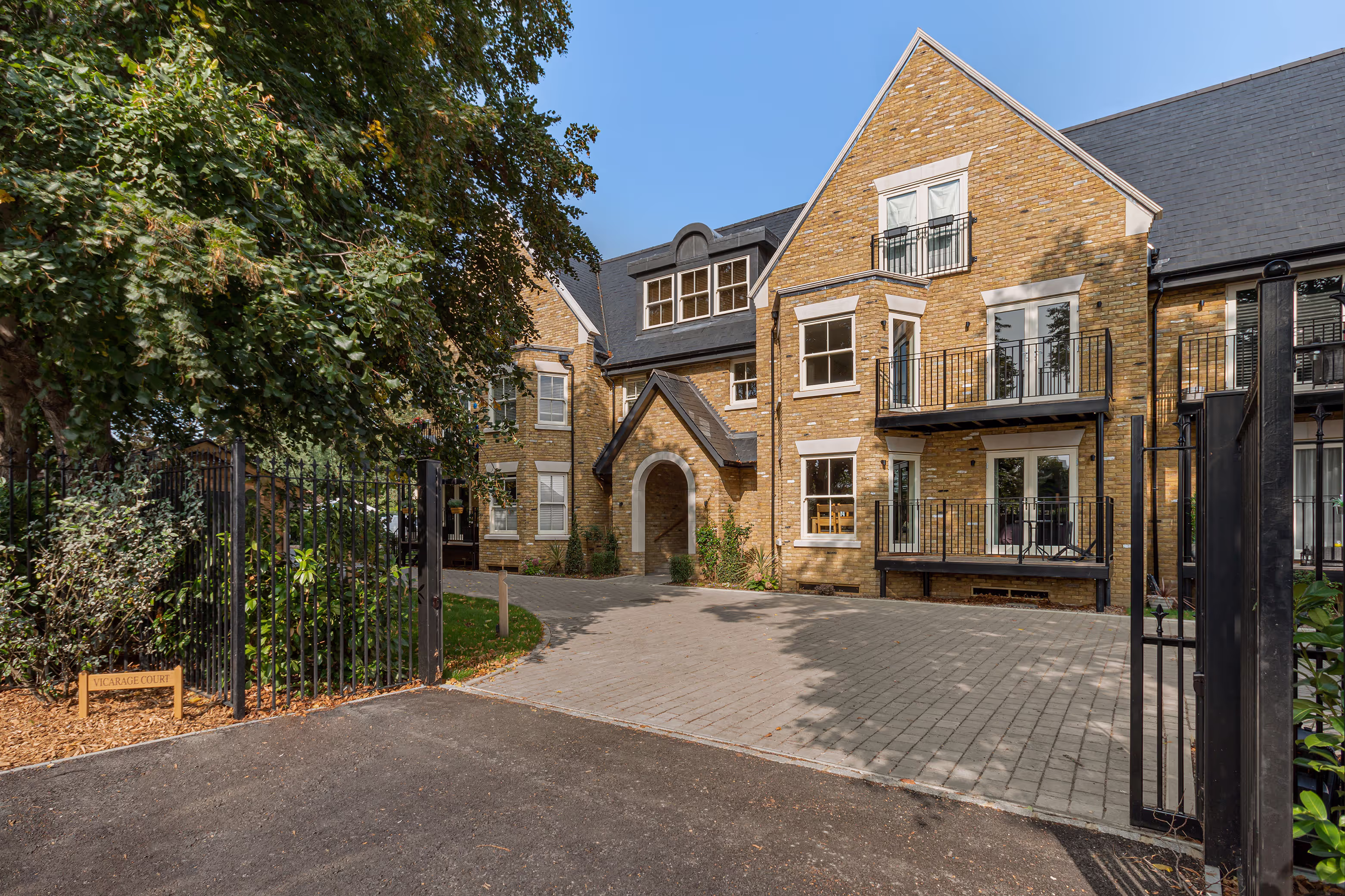 Front gate and façade of Vicarage Court, a build by The Property Partnership