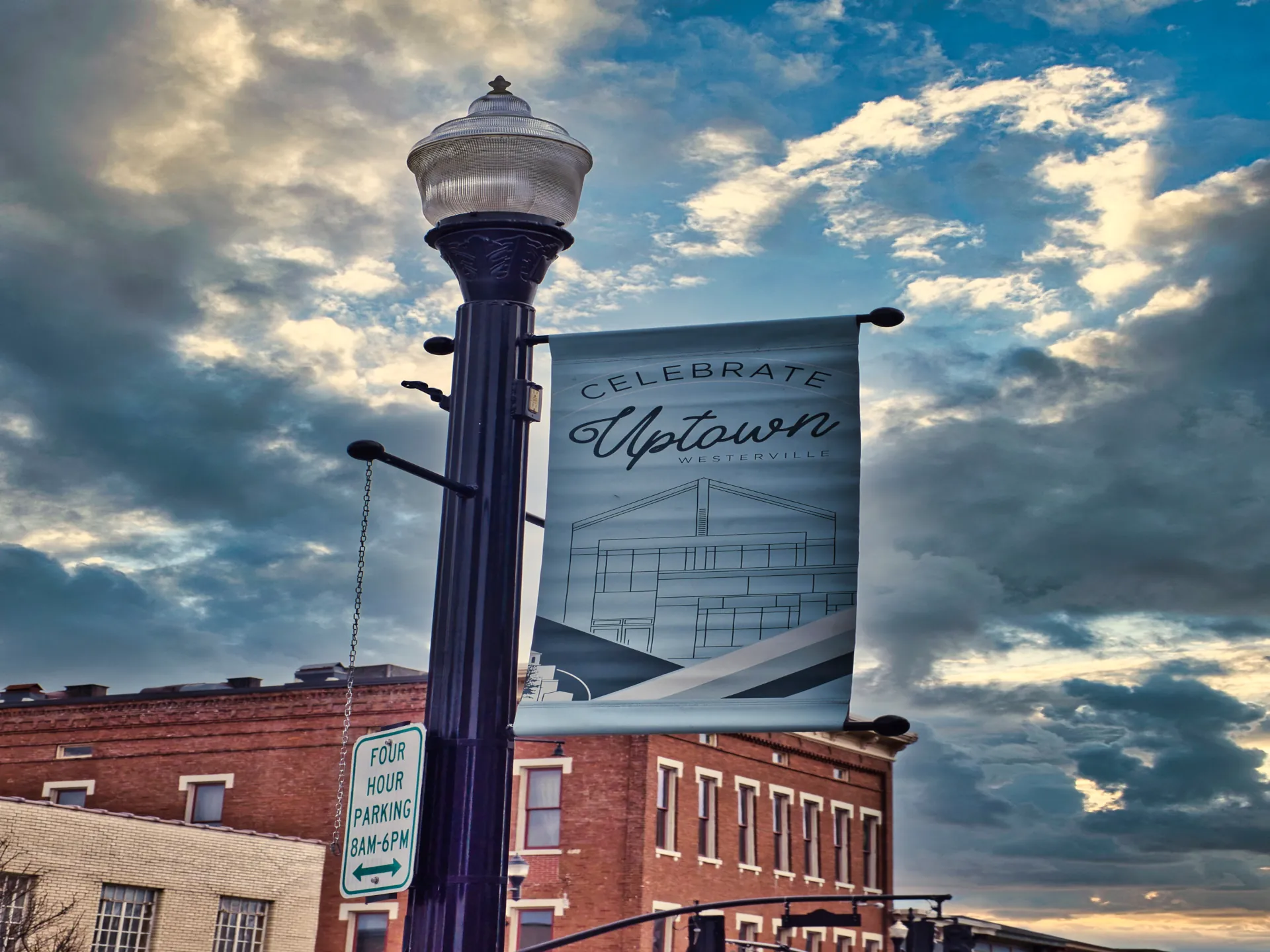 A lamp post with a banner that says "Celebrate Uptown Westerville"