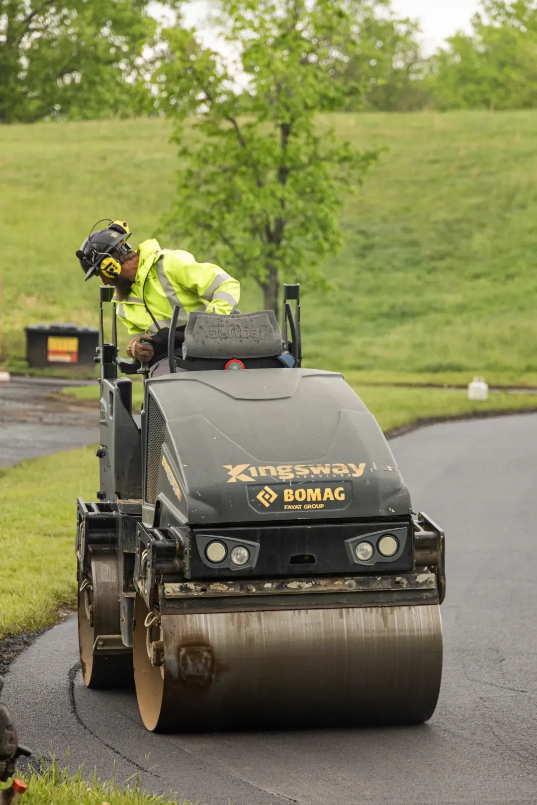 kingsway worker on riding roller vehicle