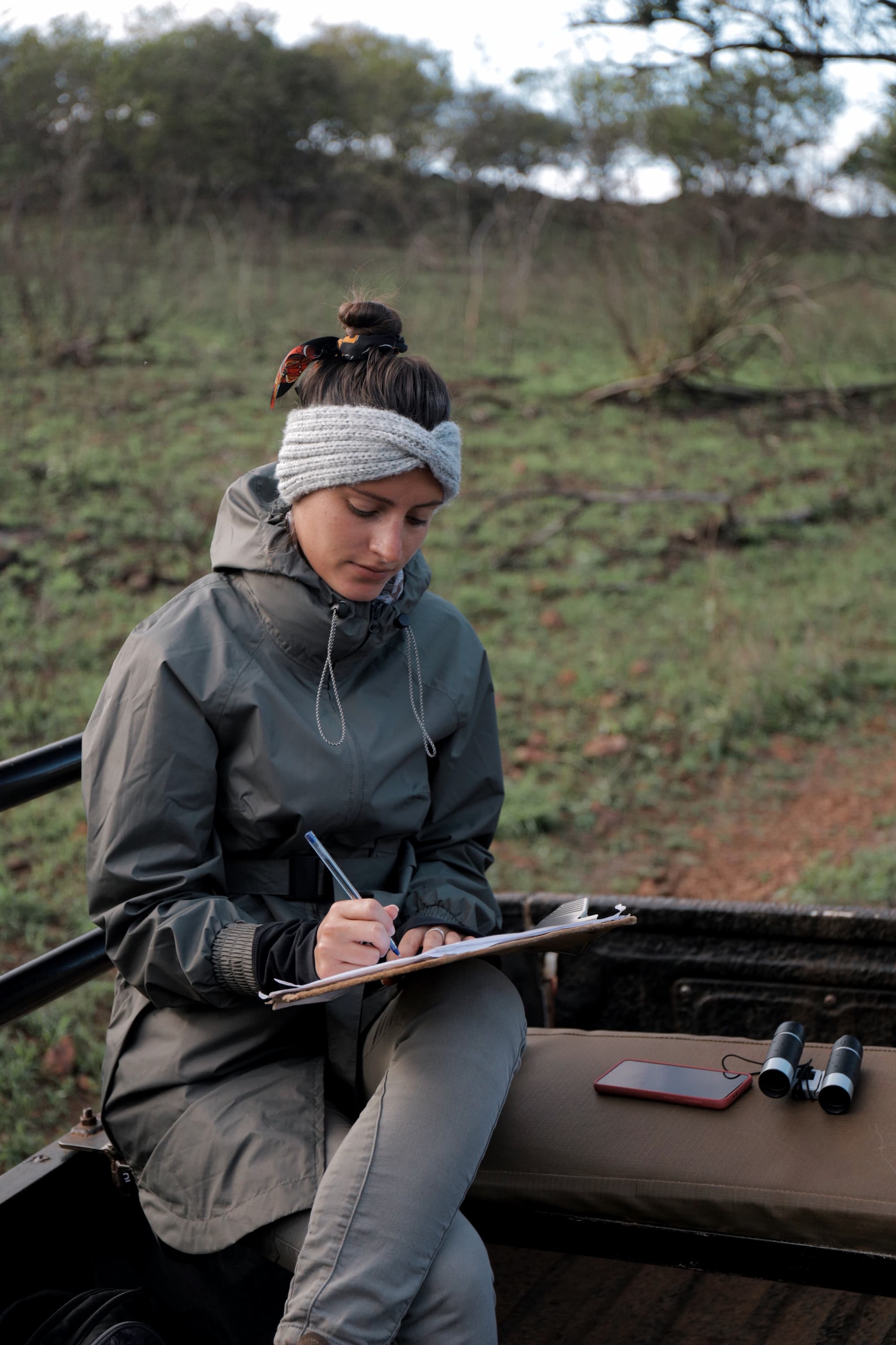 Volunteer recording GPS coordinates and behavioural data during a wildlife sighting