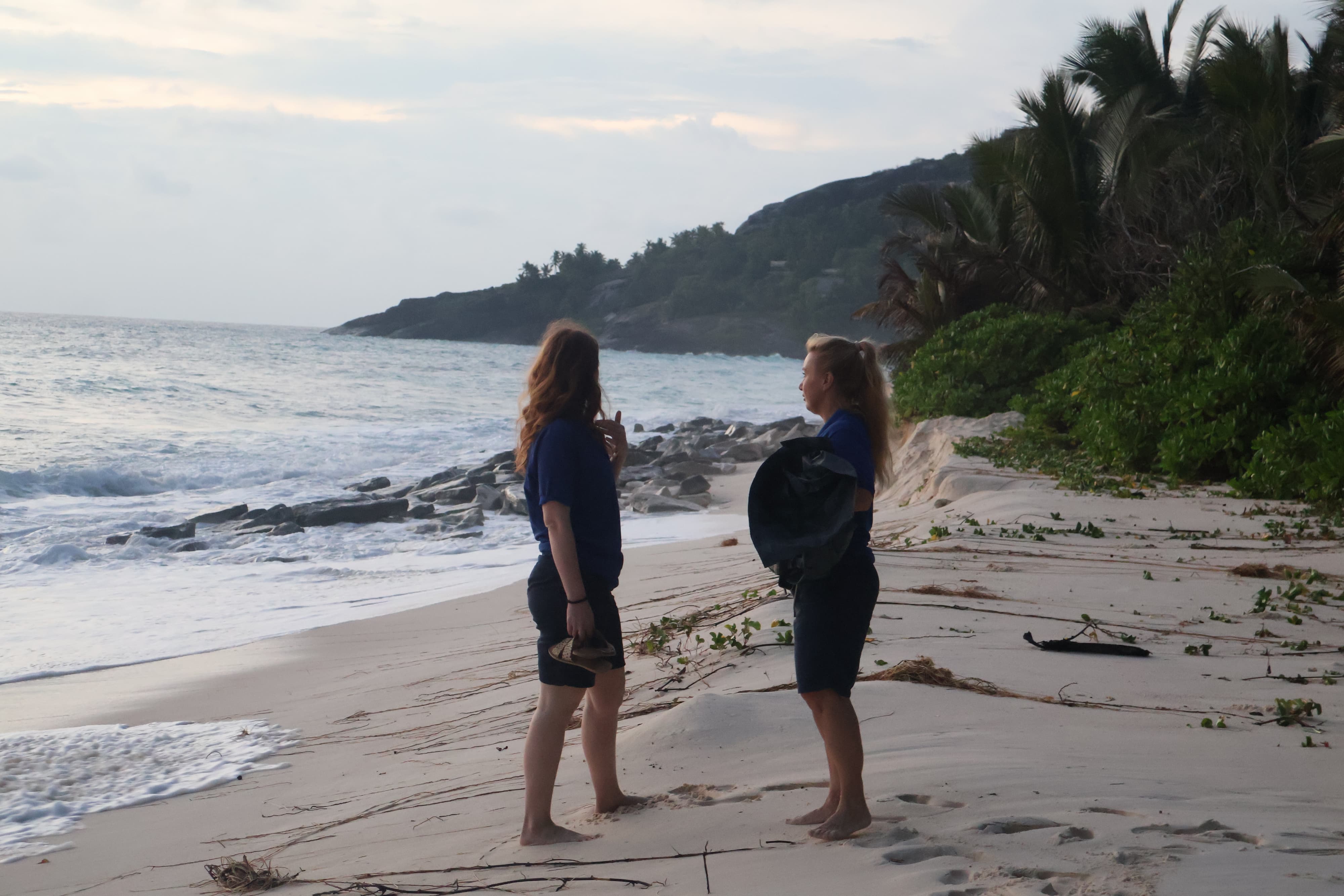 Ecotourists conduct a morning beach patrol and trash cleanup on North Island, Seychelles. 