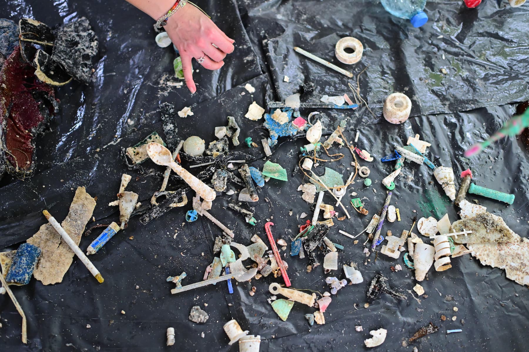 Plastic and other debris laid out for sorting