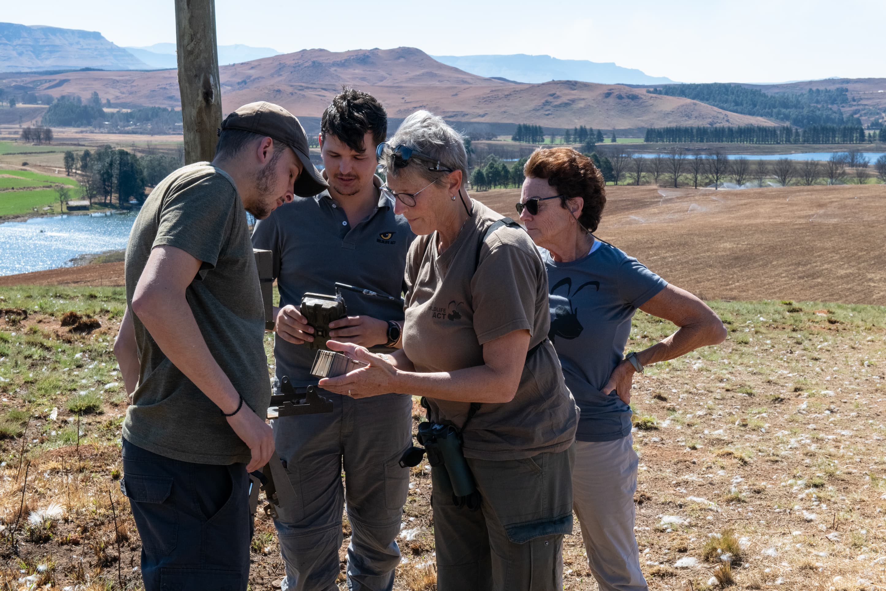 The Southern Drakensberg Conservation team and volunteers assess camera traps.