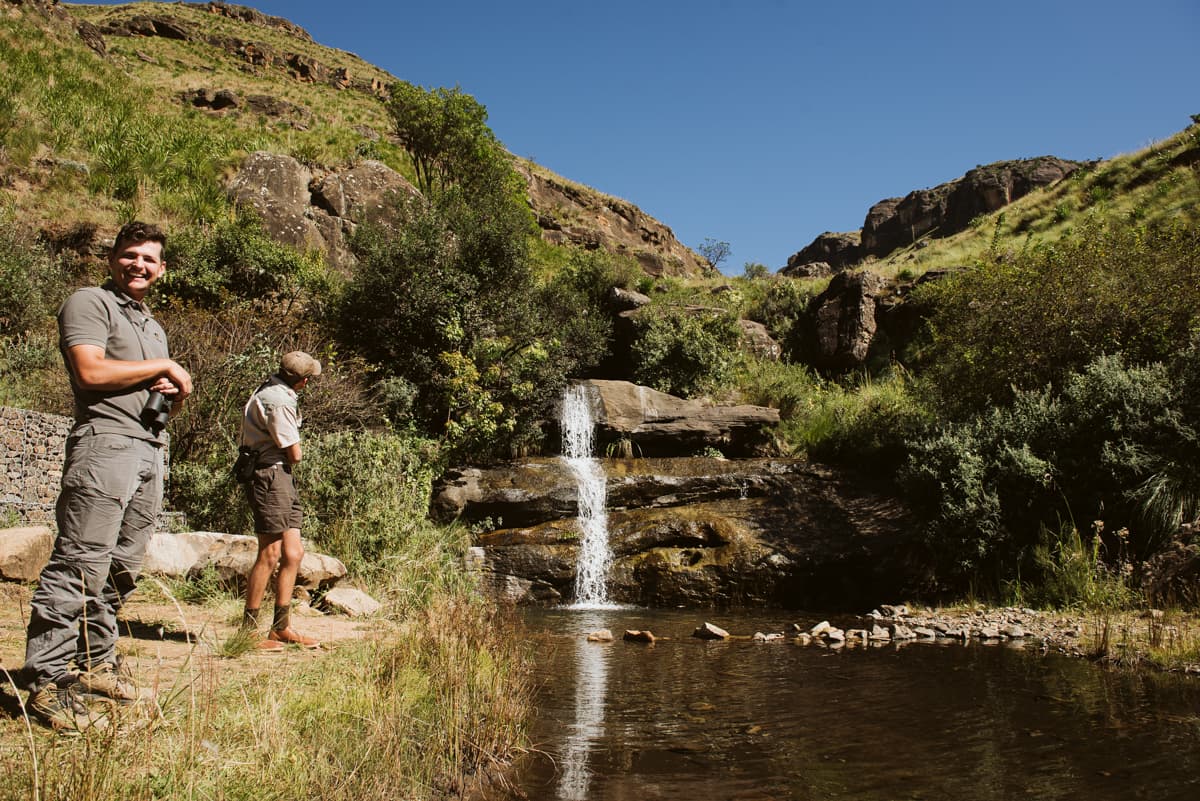 Wildlife ACT team member enjoying the Drakensberg landscape during a conservation monitoring session in South Africa