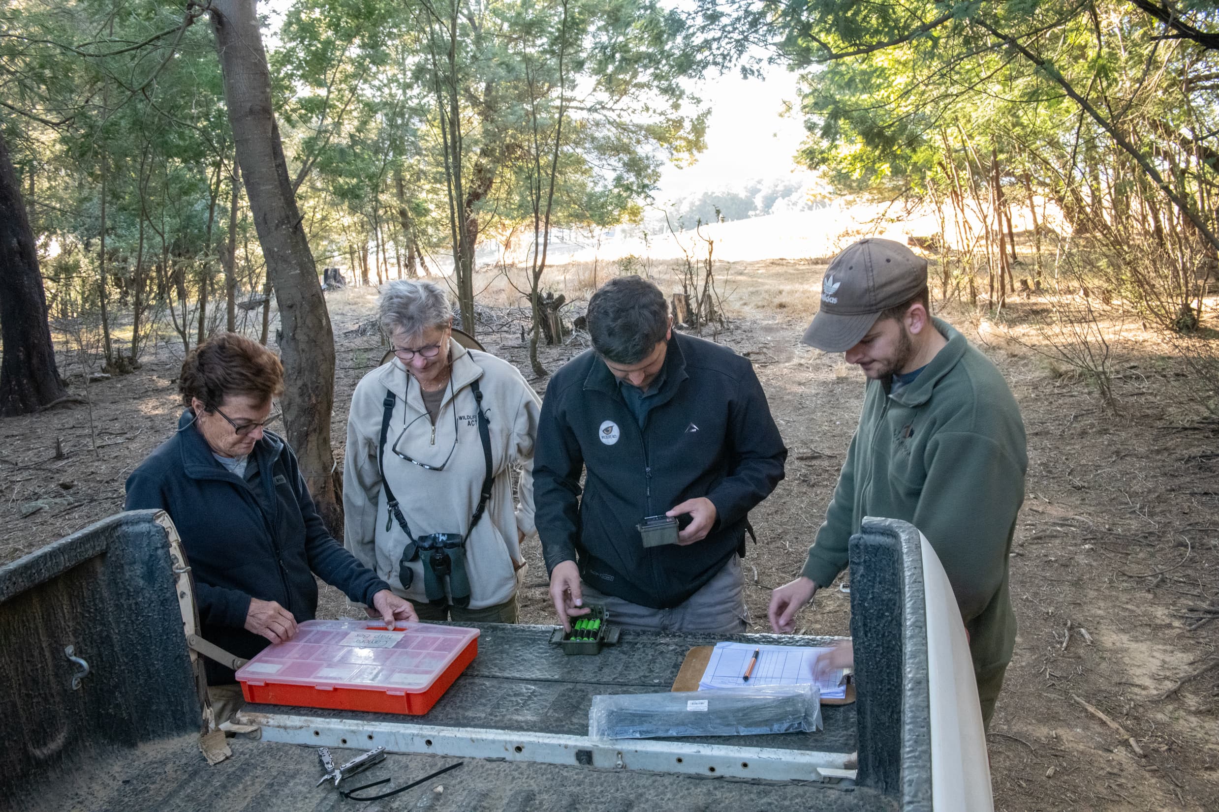 Wildlife conservation volunteers assisting with camera trap surveys in South Africa as part of biodiversity monitoring