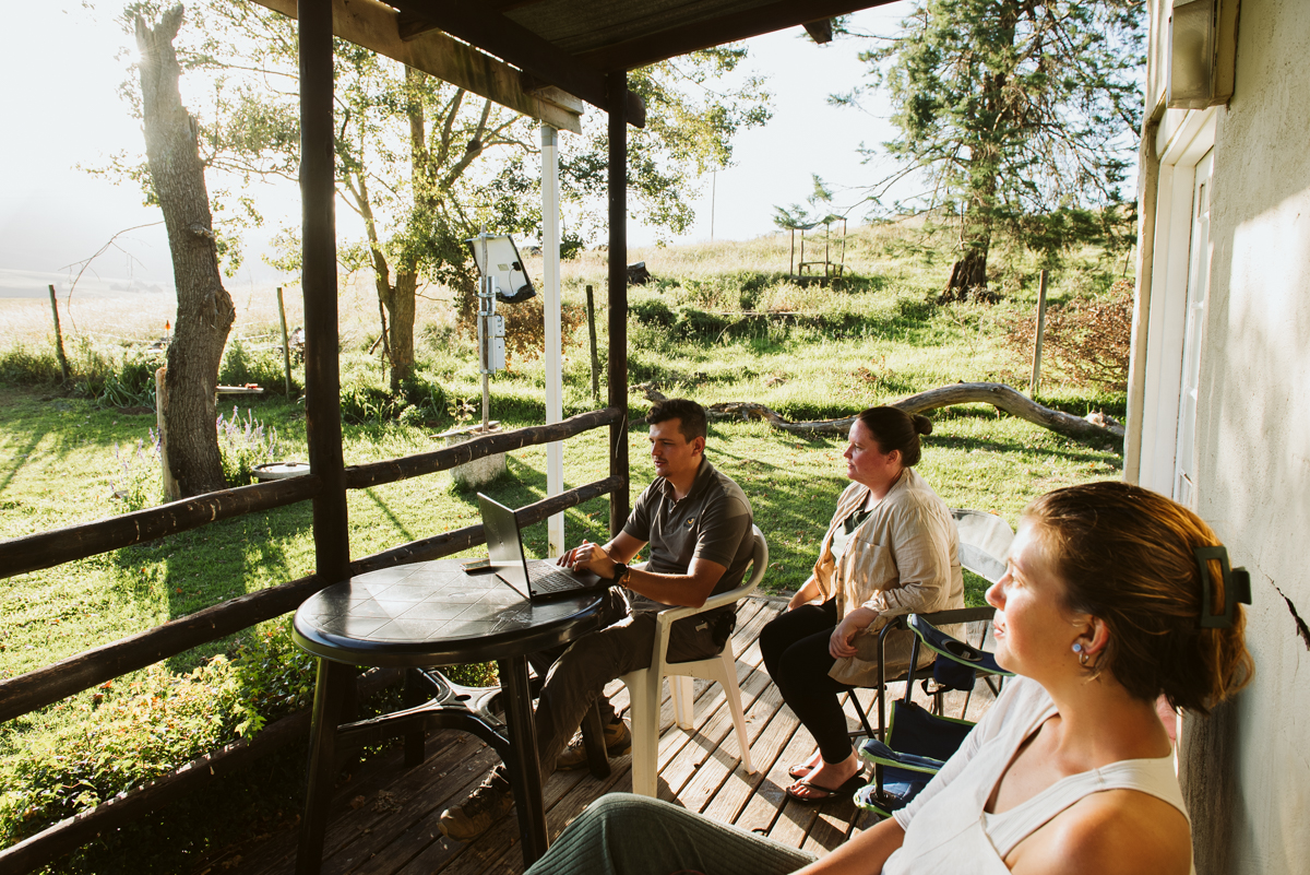 Team working with data at the Gate House in the Drakensberg as part of conservation research