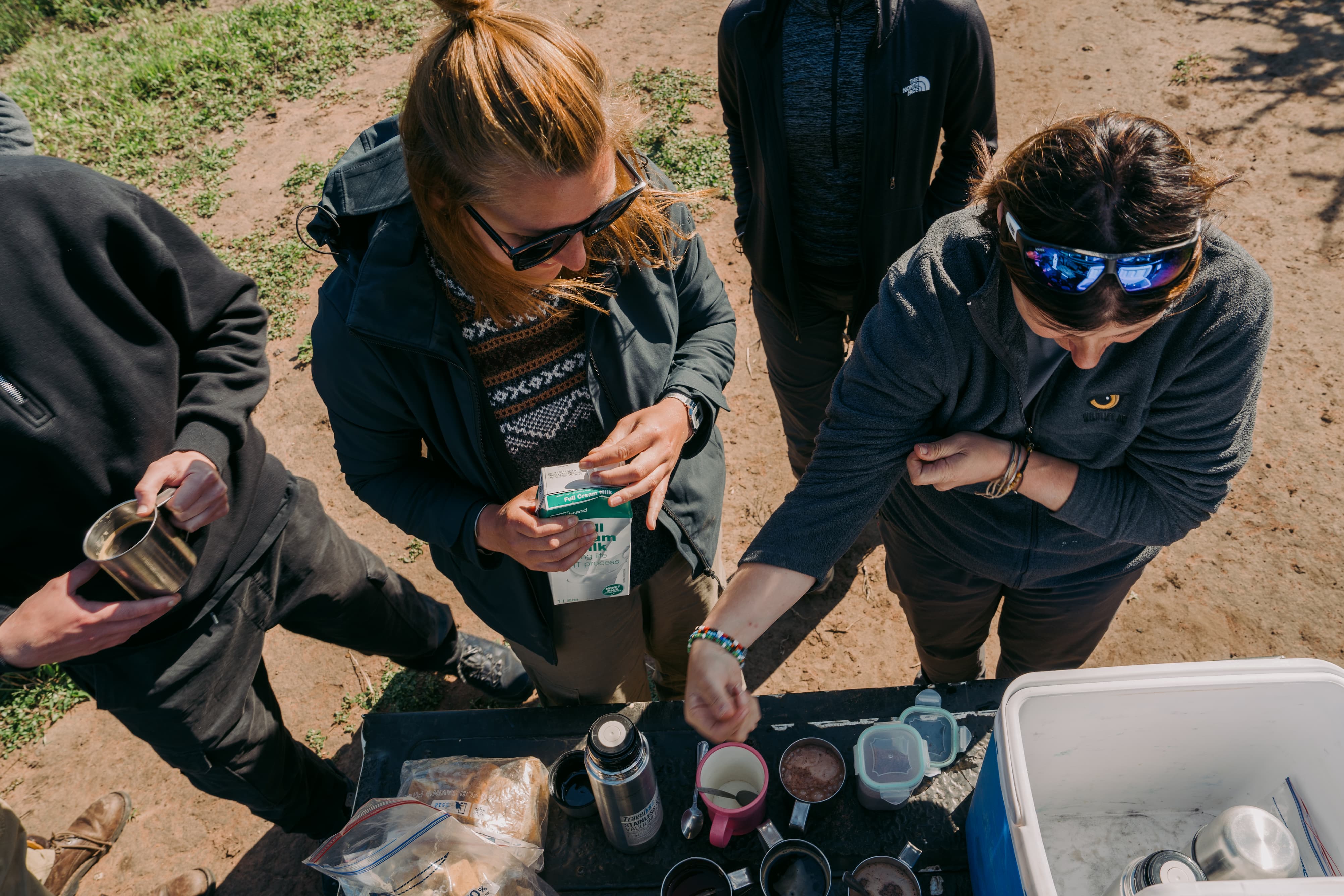 Wildlife ACT volunteers preparing coffee on the back of the monitoring vehicle during a field session.