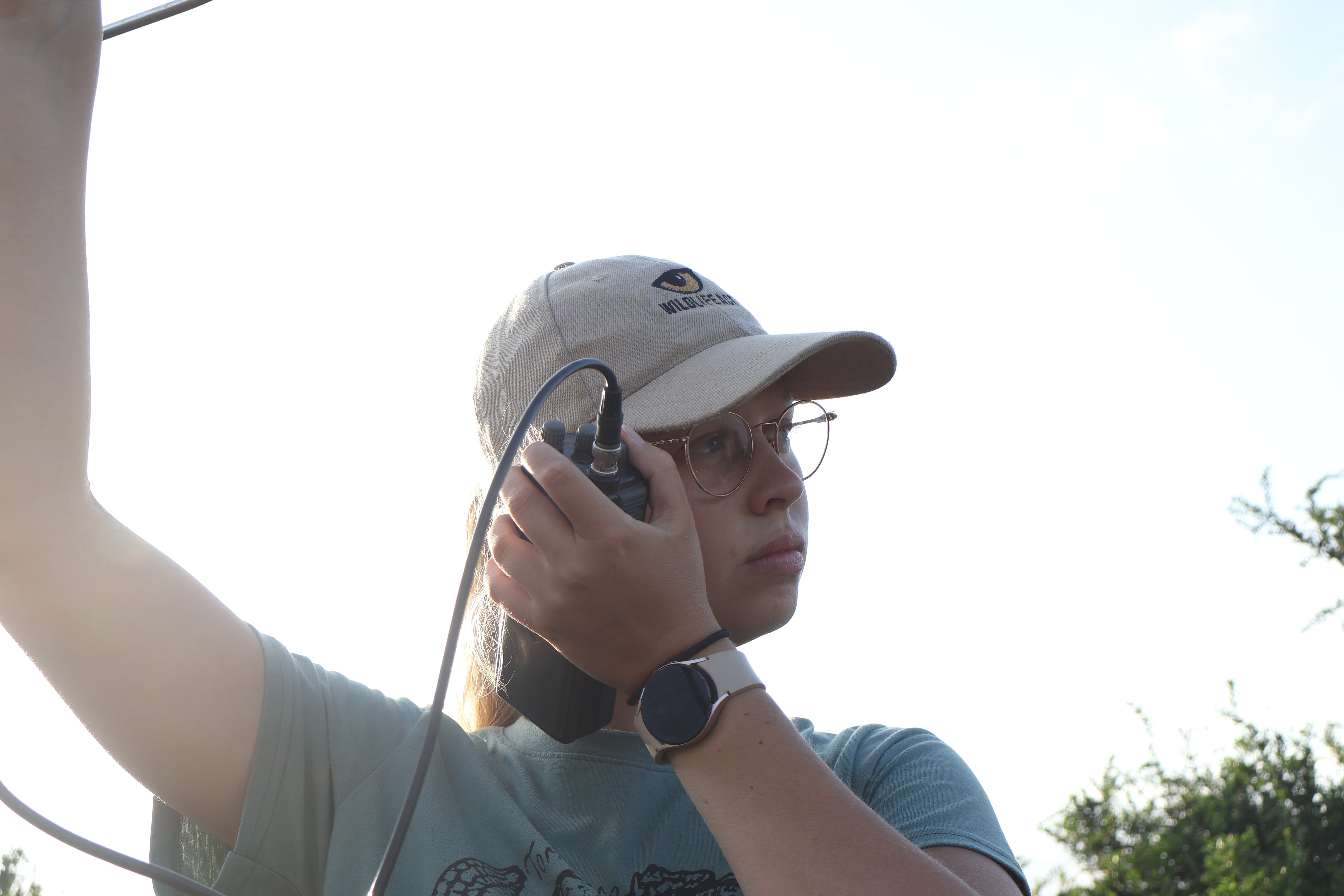 A volunteer listens to the telemetry device