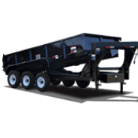 Truck towing a flatbed trailer at sunset