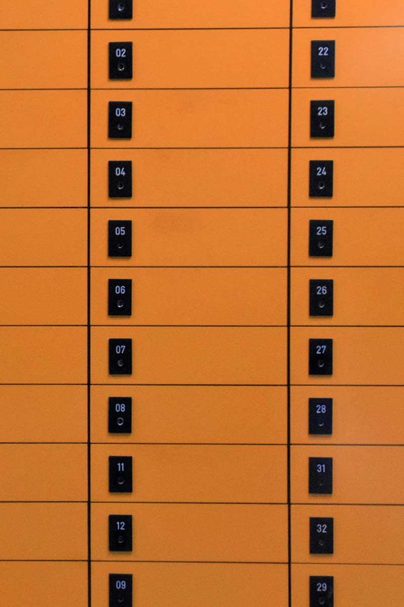 Vertical rows of yellow personal package lockers
