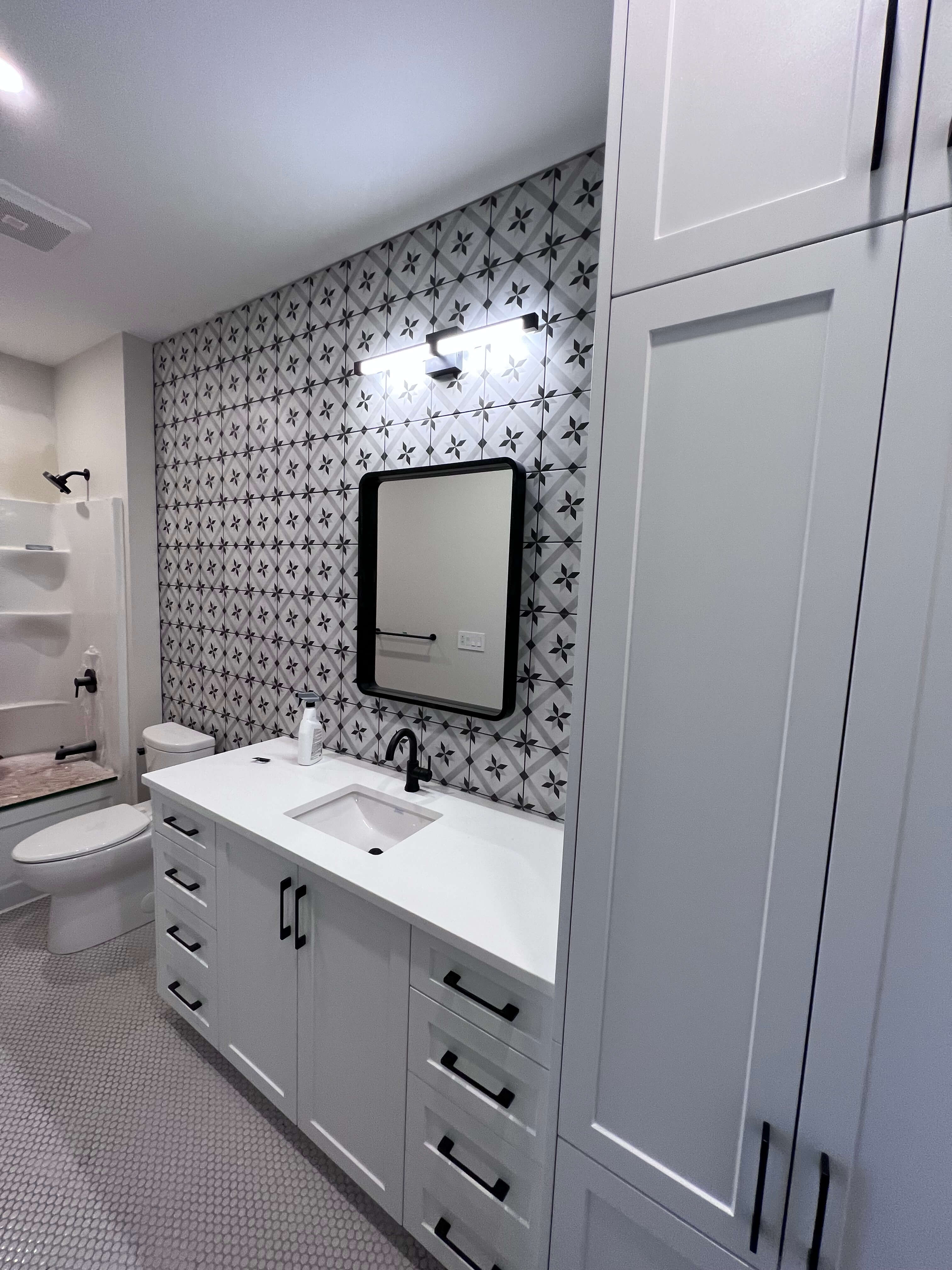 New renovated bathroom with patterned tiles