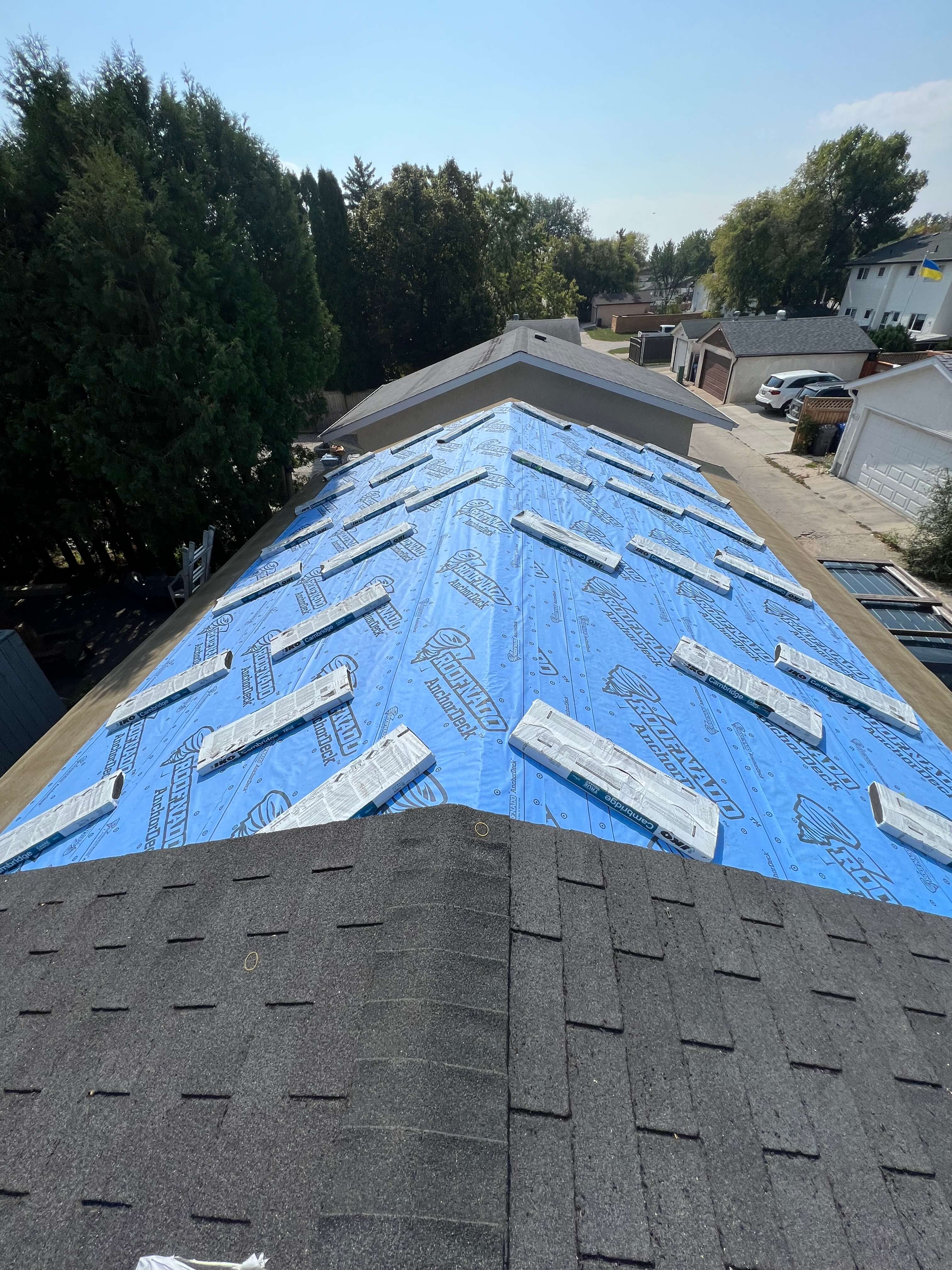 Removing and installing new shingles on buildings 