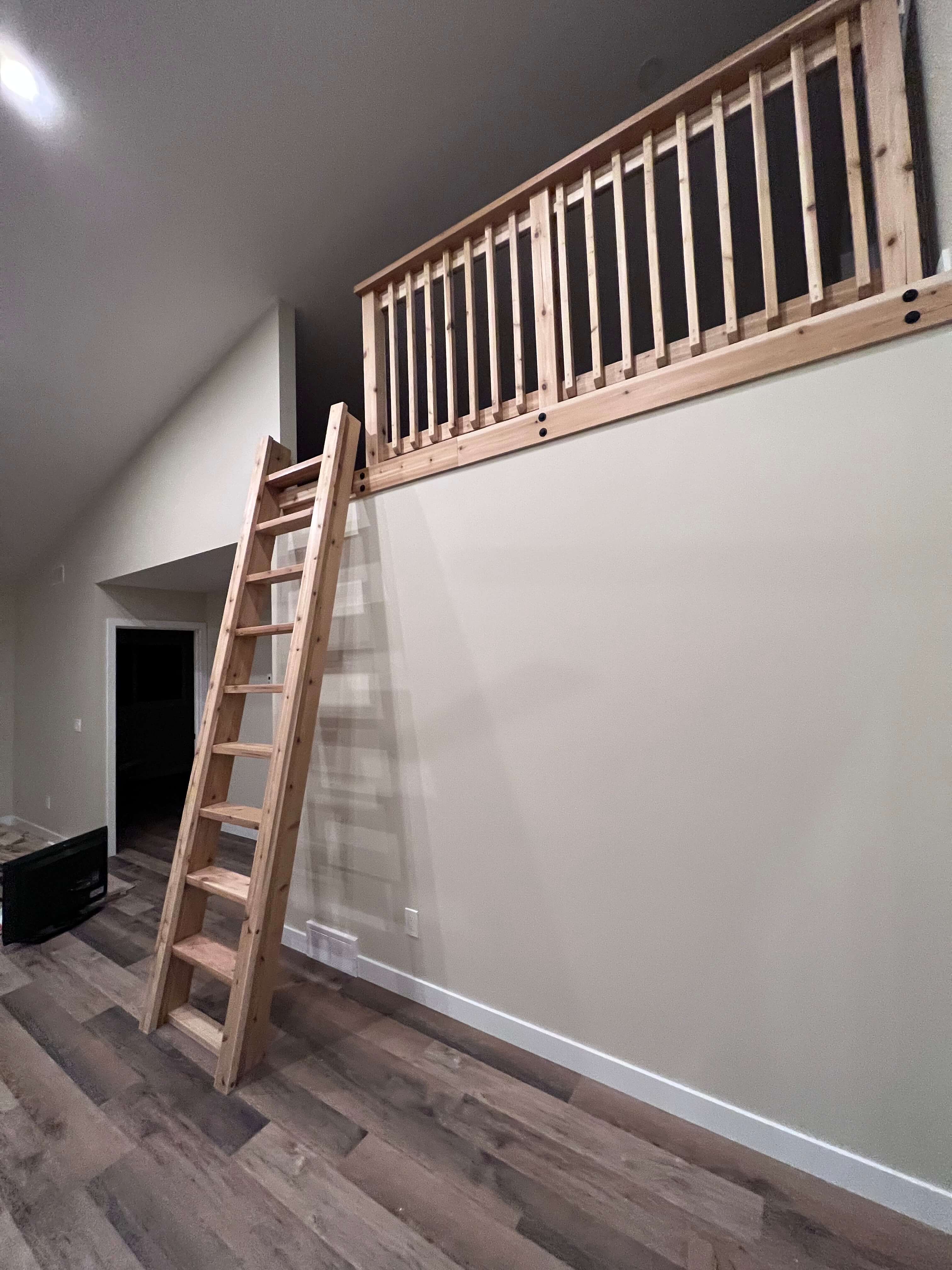 Interior wooden railing with ladder