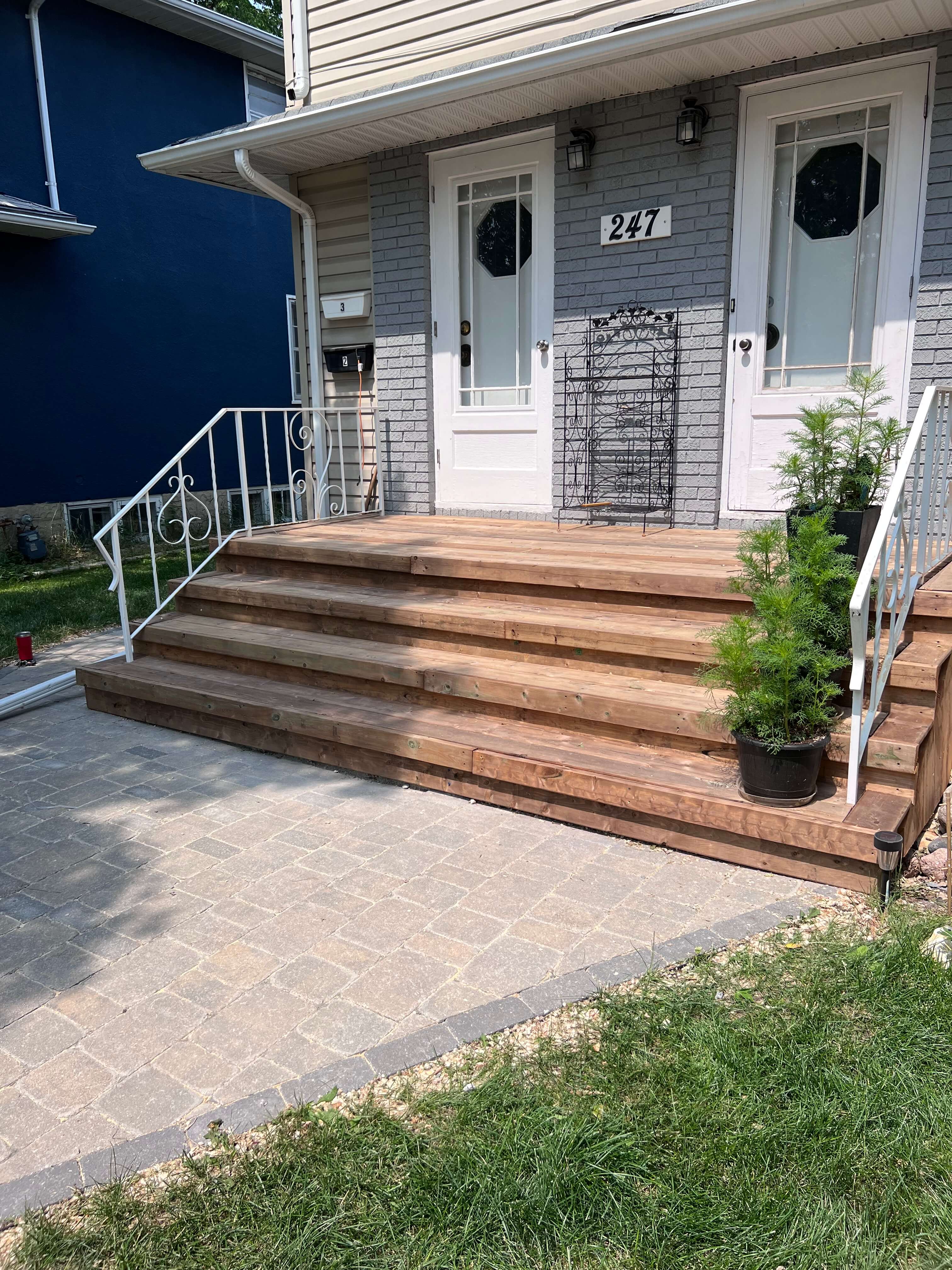 Wooden stairs leading to home entrance