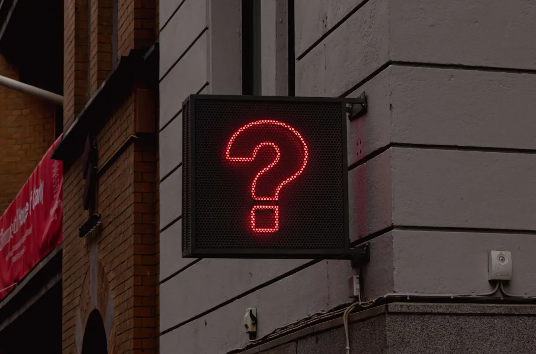 Red question mark sign on a building