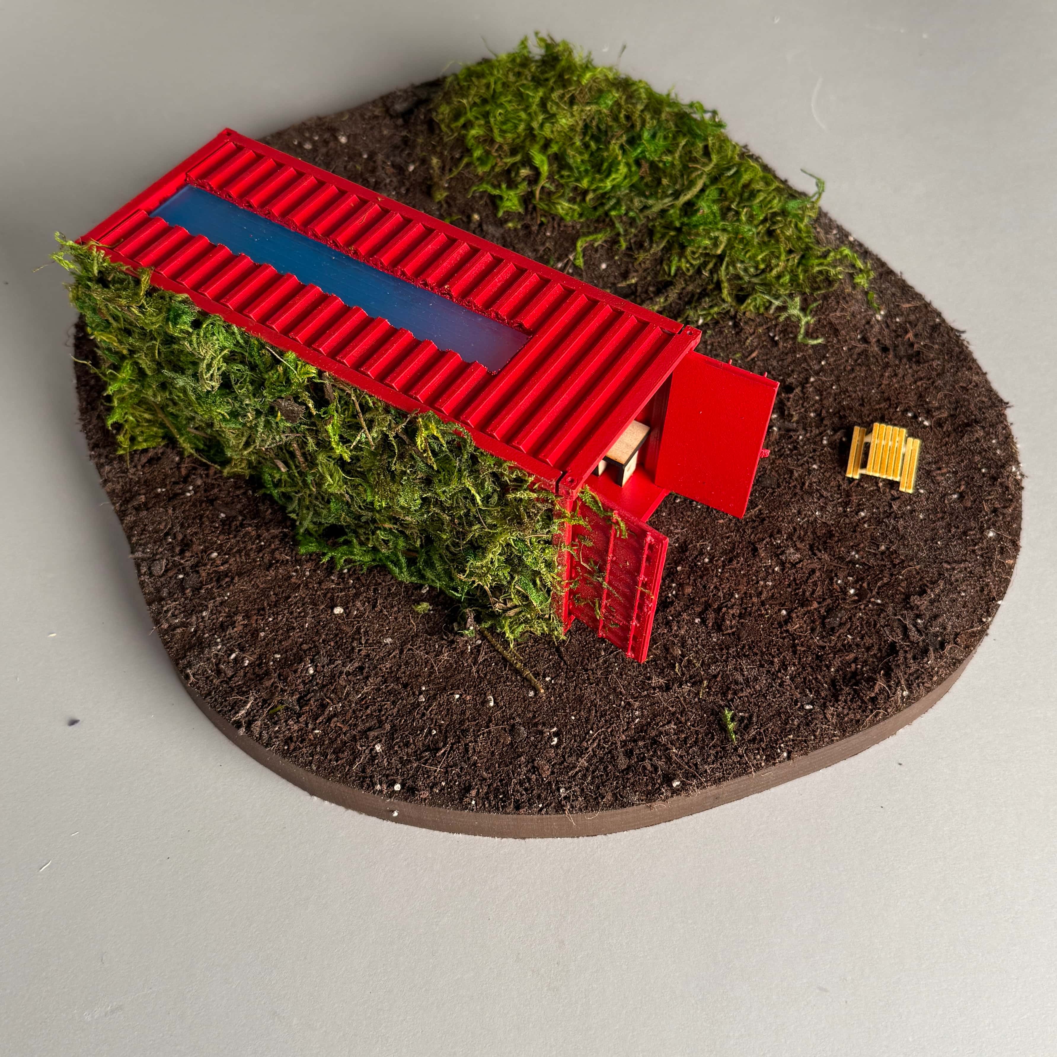 Bitewise smart restaurant recommendation device, featuring a white box with a QR code, a blue button, an embedded thermal printer, and a spring-mounted decorative chef hat, set against a blurred, warmly lit background.