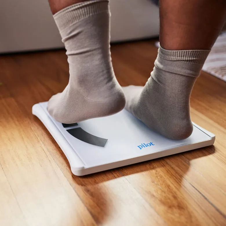 Man stepping on a weight scale