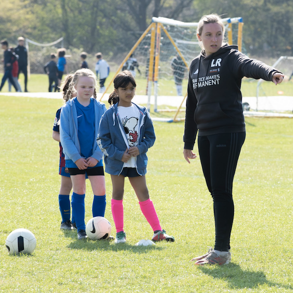 female coach with girls 