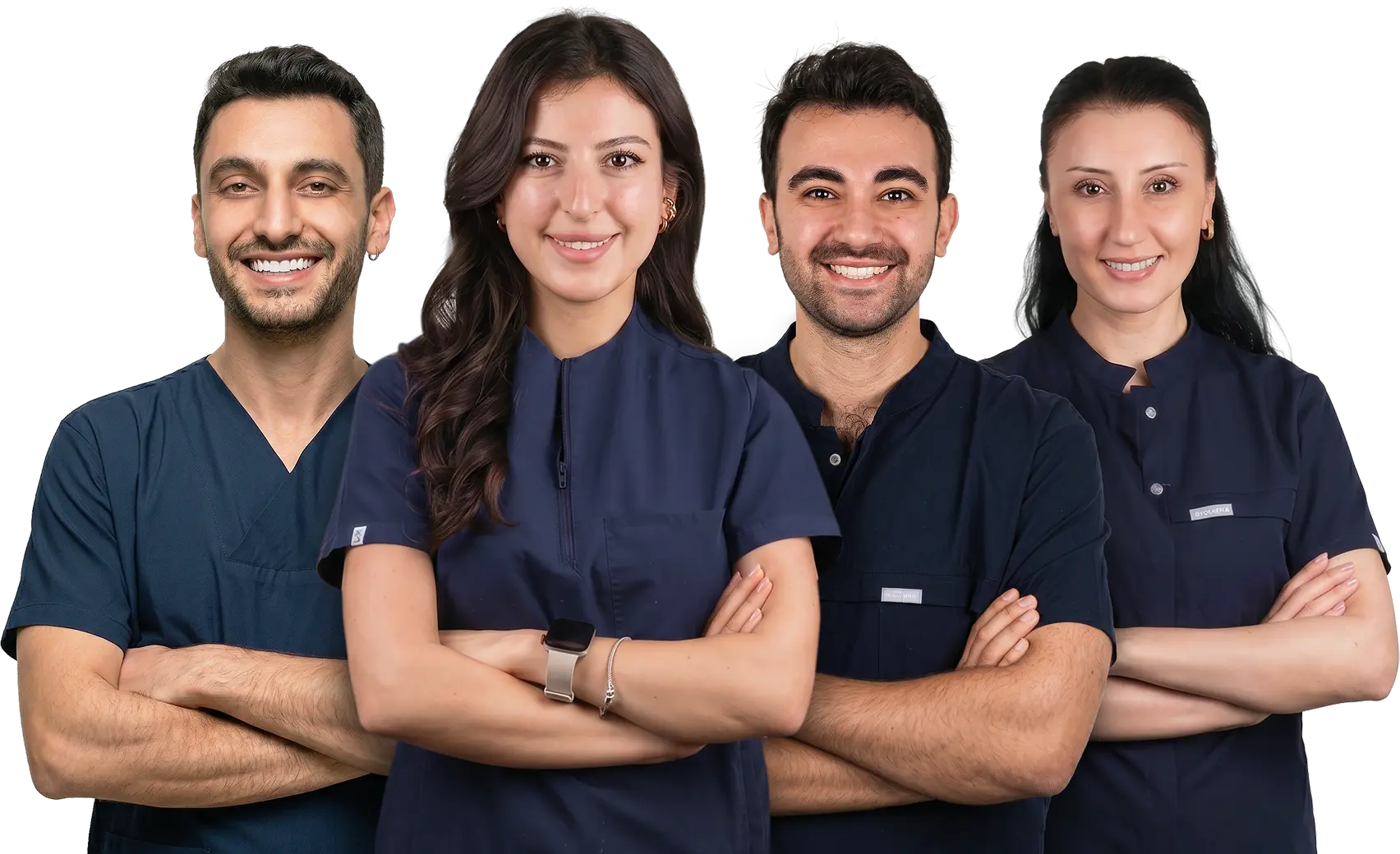 Four smiling medical professionals standing side by side with arms crossed, wearing dark blue scrubs on a transparent background.