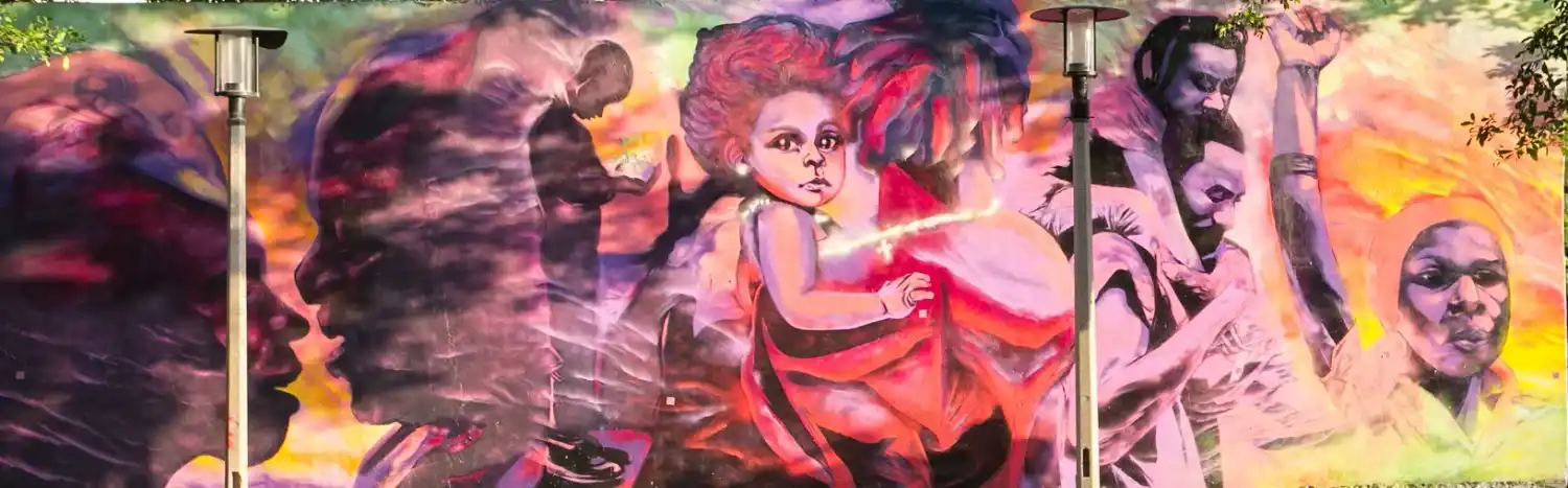 Colorful mural with diverse figures and expressive faces.