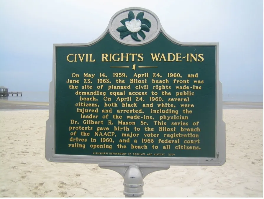 Historical marker detailing civil rights wade-ins at a beach.