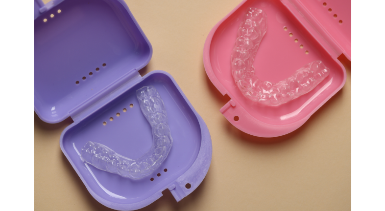 Clear aligners with blue and purple storage case