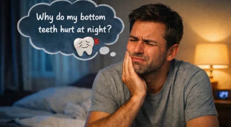  Man sitting on bed at night with a painful expression, holding jaw, thinking about bottom teeth hurting at night.