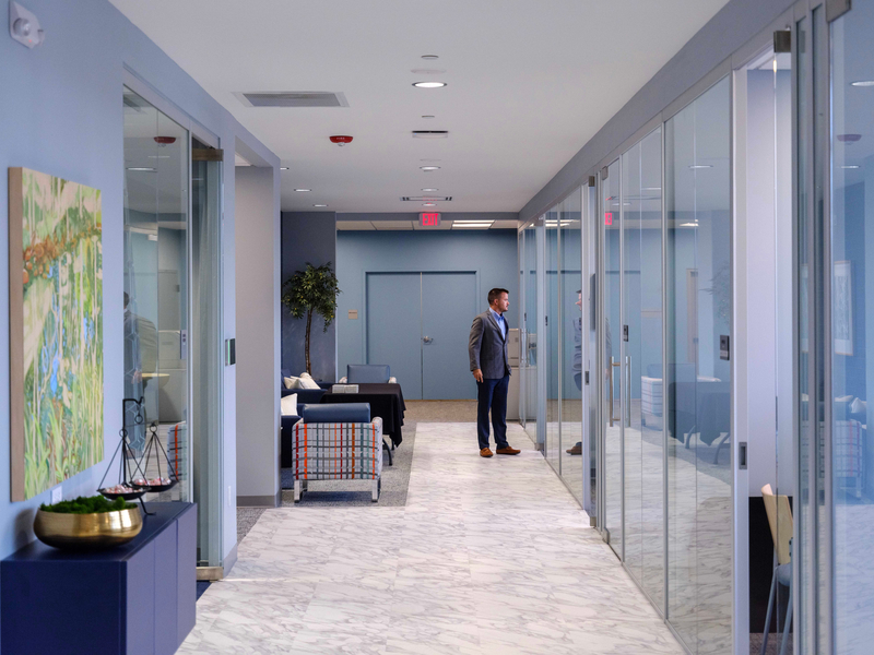 Gray Ice Higdon team member standing in office interior