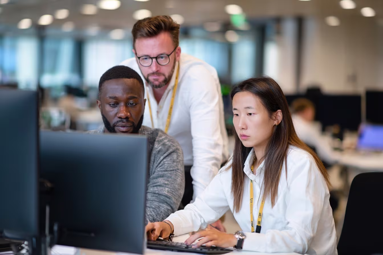 Colleagues collaborating in zero trust security office
