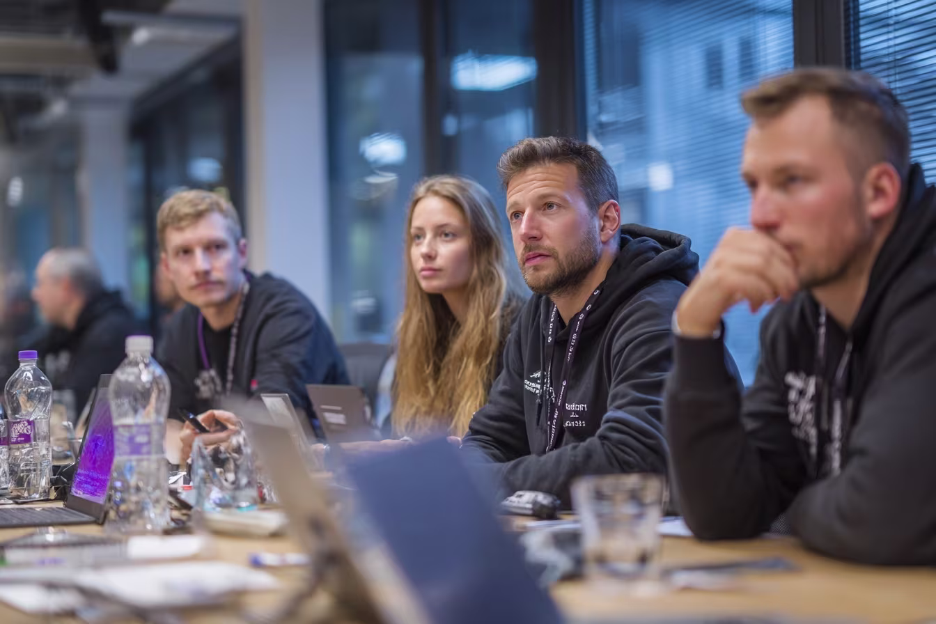 Diverse team discussing threat intelligence services