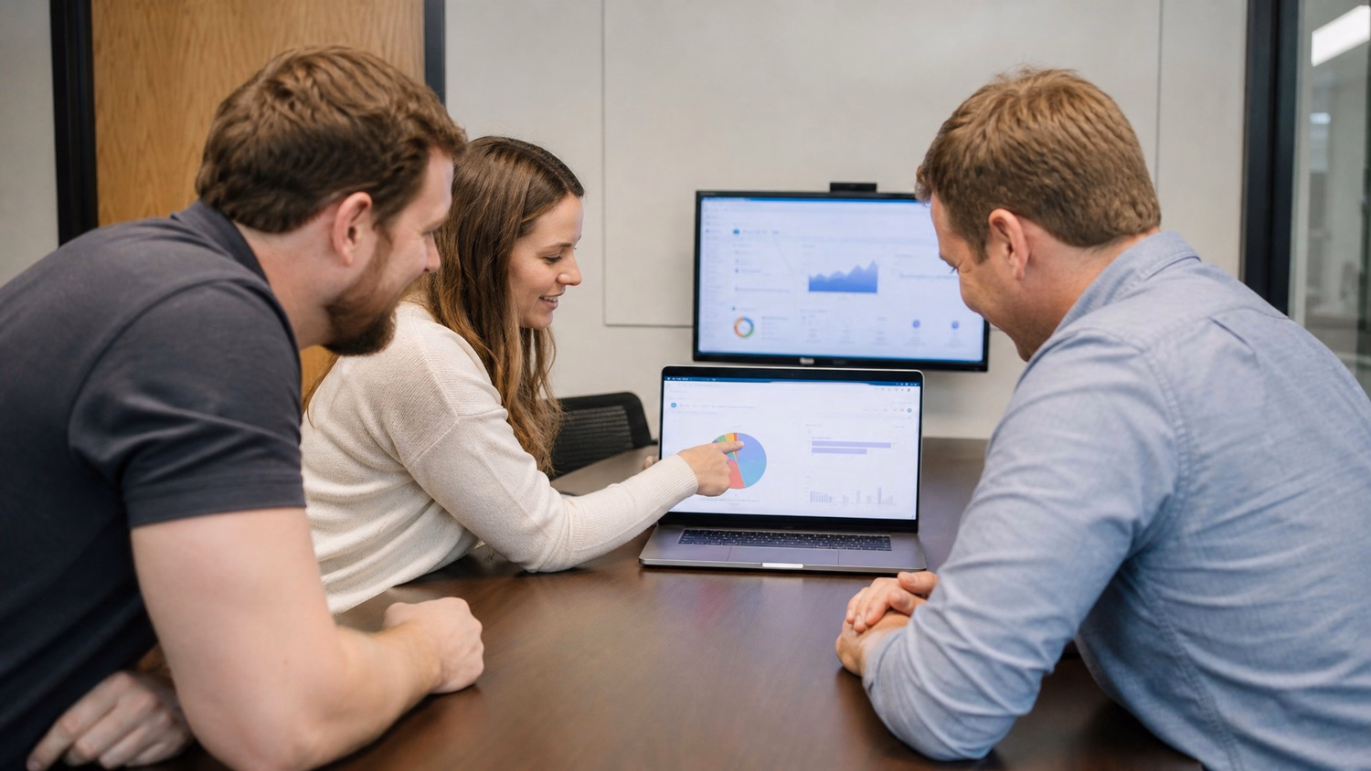 IT team reviewing network diagnostics at standing desk 67 chars