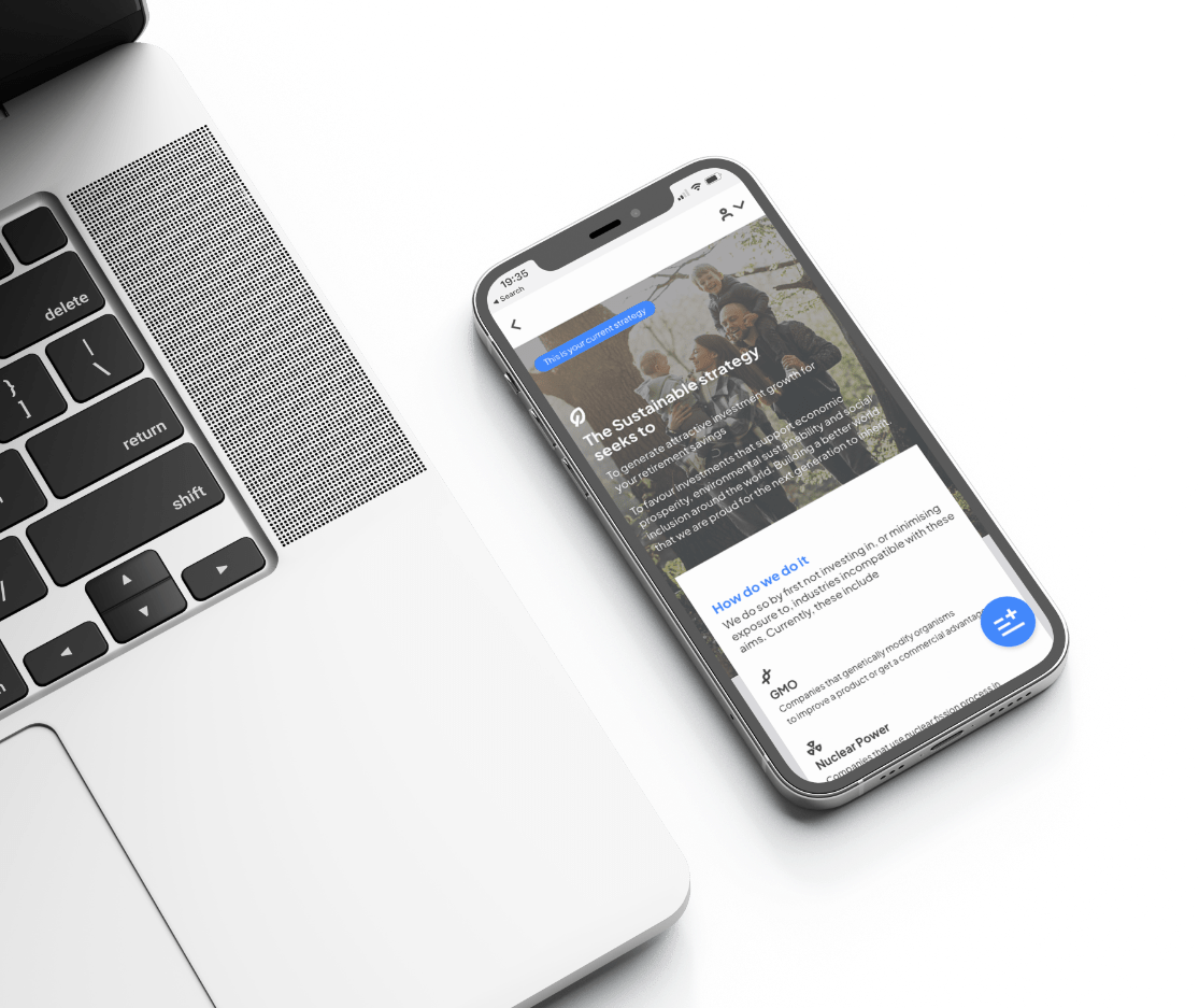 A phone on a table with a macbook