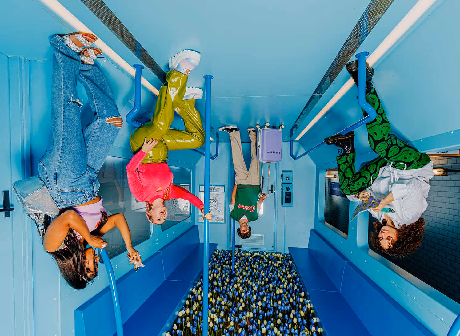 A group of people hanging upside down in a room.