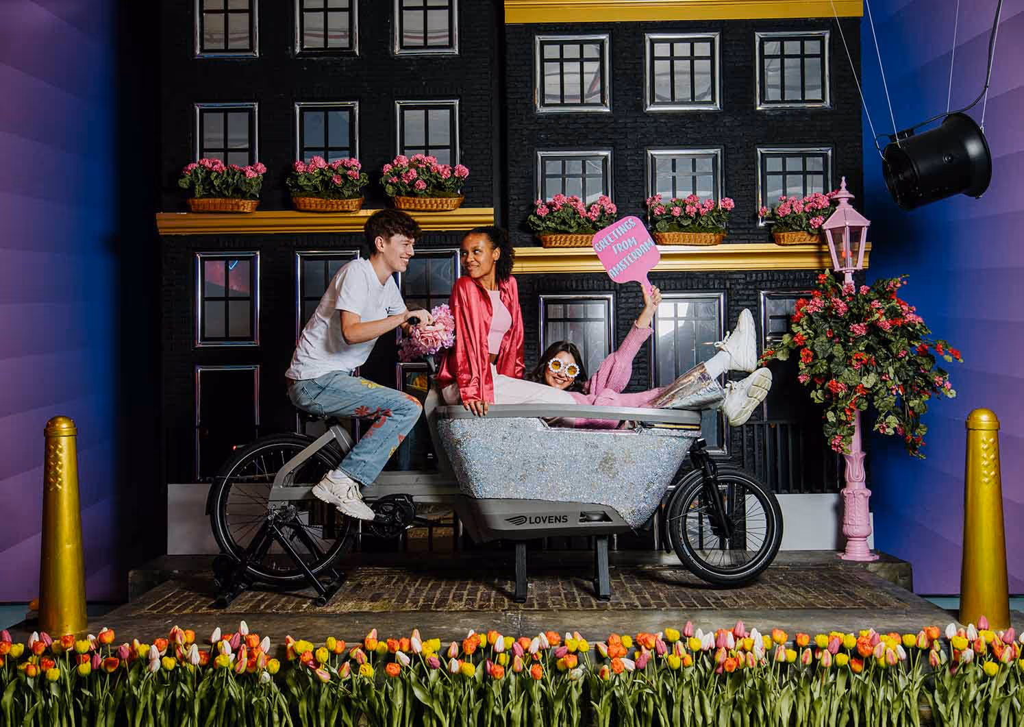 A couple of people that are sitting in a baby carriage.