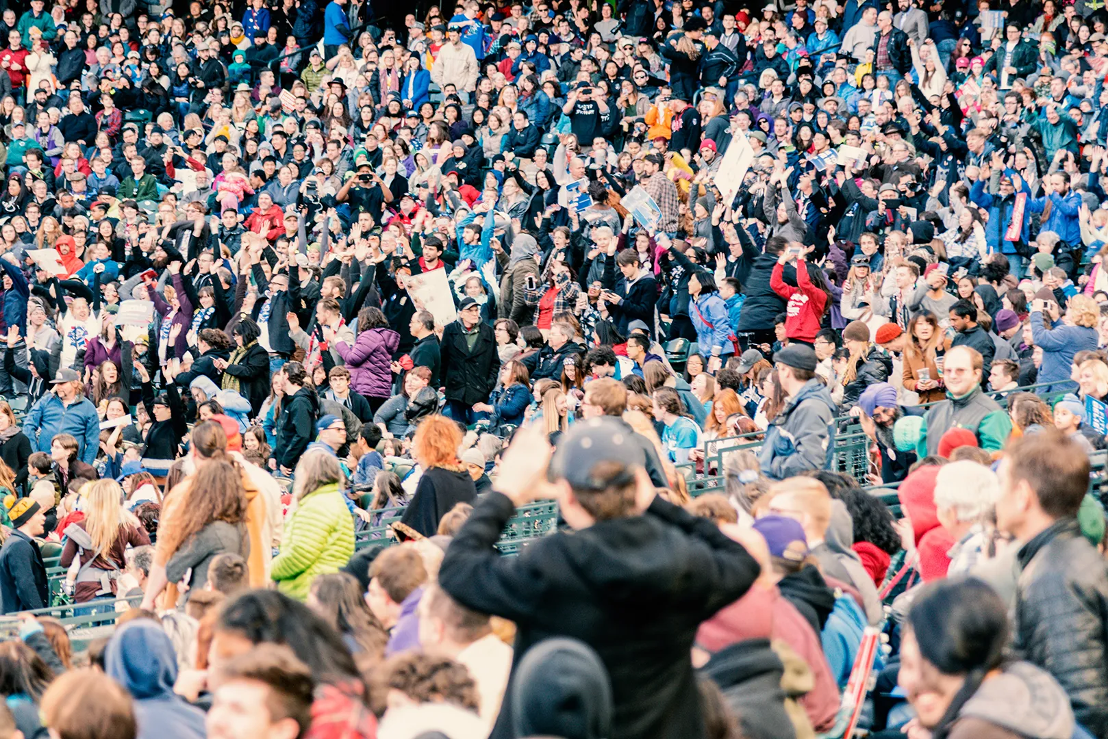 Large crowd of fans filling the stands at a stadium event.