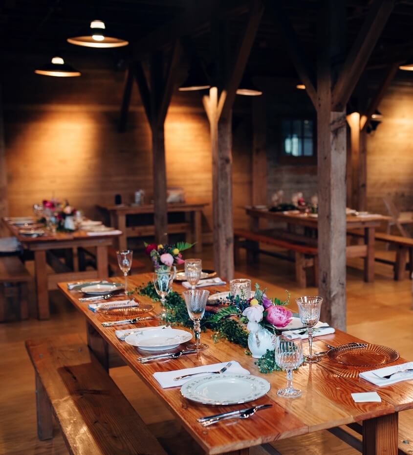 Table settings for a dinner in the barn!