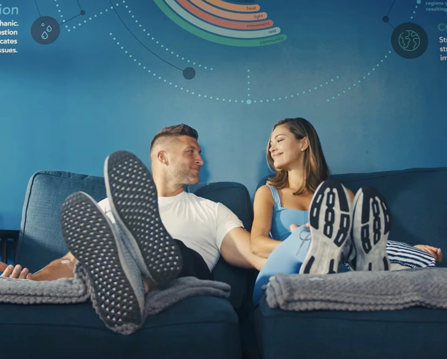 Tim and Demi Tebow sit inside Restore Hyper Wellness