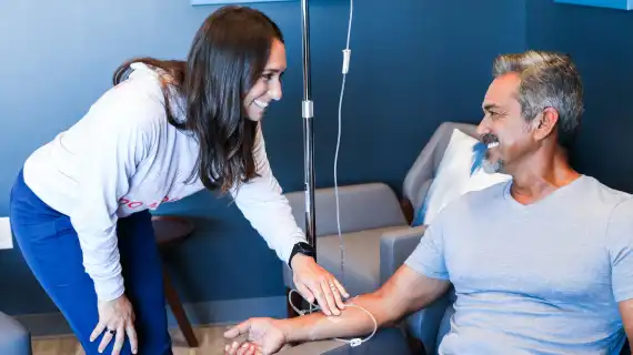 Nurse tends to Restore client