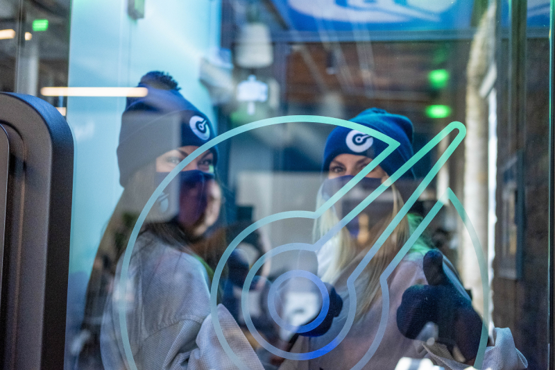 Man and woman smiling at each other while getting compression treatment. 